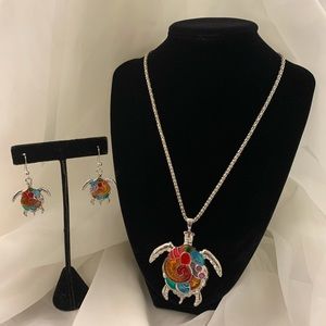 Extremely colorful turtle necklace with earrings.